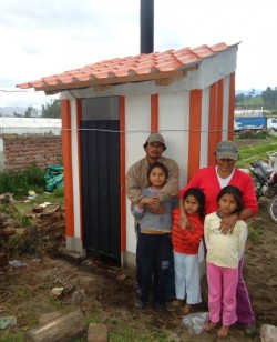 A family in Chambo with its new Dry Toilet